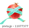 Measure tape on red pomegranate 11077377