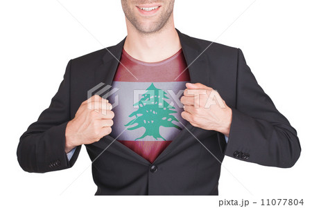 Businessman opening suit to reveal shirt with flag 11077804