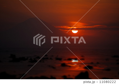 Sunset on the ocean - view of volcano Batur. Indonesia, Bali. Sunset on the ocean - view of volcano Batur. Indonesia, Bali. 11080222