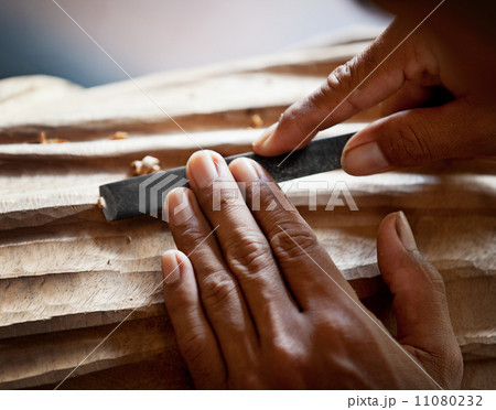 Hands woodcarver with the tool close-up 11080232