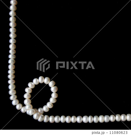 White pearls on the black background White pearls on the black background 11080623