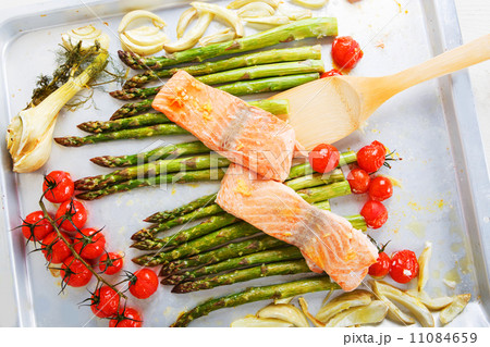 Salmon fish and green aspargus, cherry tomatoes and fennel 11084659