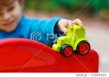 Little toddler boy playing with car toy 11084824