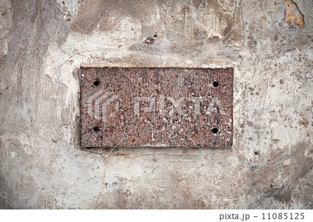 Empty granite label stone in old gray concrete wall 11085125