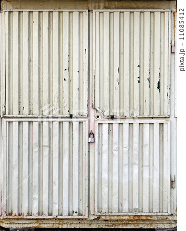 Locked gate of an small metal kiosk Locked gate of an small metal kiosk 11085412