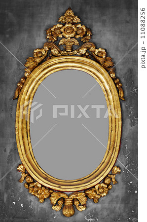 Old-fashioned gilt frame for a mirror on a concrete wall Old-fashioned gilt frame for a mirror on a concrete wall 11088256