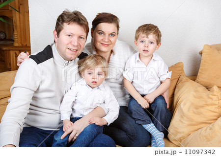 Happy family of a four having fun at home 11097342