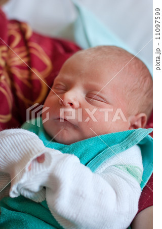 Newborn baby boy only few hours old 11097599