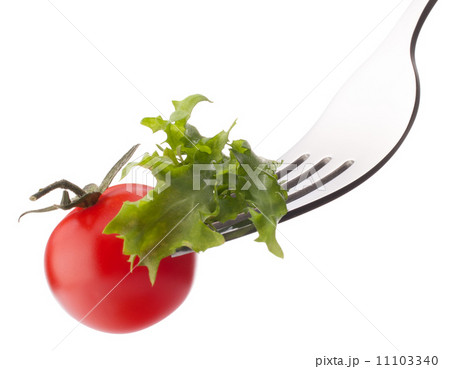 Fresh salad and cherry tomato on fork isolated on white backgrou 11103340