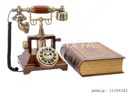 Ancient phone and book Ancient phone and book 11104282