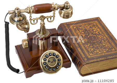 Ancient phone and book Ancient phone and book 11104285