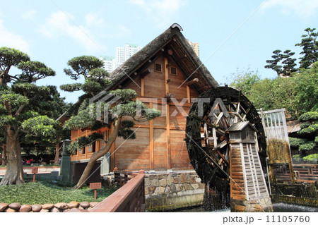 Chinese cottage and waterwheel 11105760