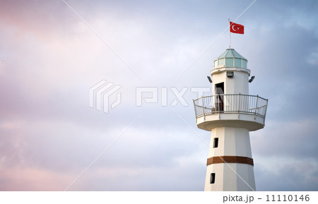 Upper part of white Lighthouse with Turkish flag on top. Avsallar, Alanya, Turkey 11110146