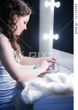 beautiful girl in a make-up room in front of the mirror 11110563
