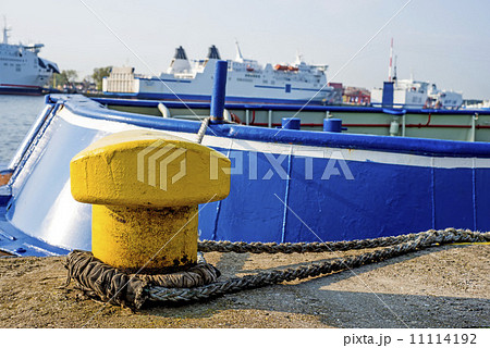 Bollard at a pier with ferry 11114192