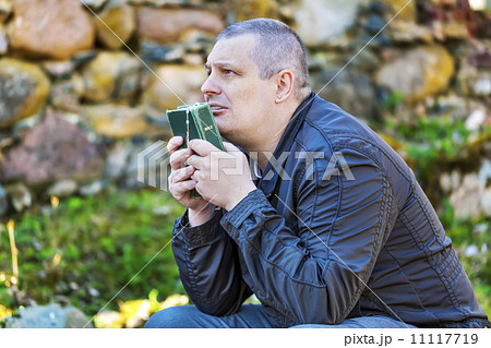 Religious man with Holy Bible and Rosary at Place of Worship Religious man with Holy Bible and Rosary at Place of Worship 11117719