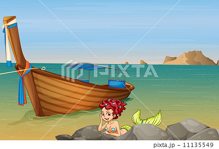 A mermaid at the sea near the wooden boat A mermaid at the sea near the wooden boat 11135549