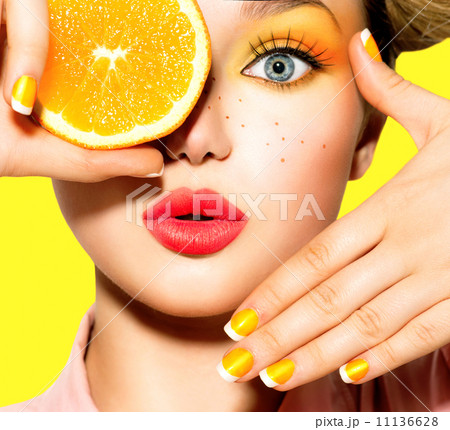 Teen girl with freckles, red hairstyle, yellow makeup and nails 11136628