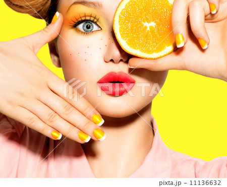 Teen girl with freckles, red hairstyle, yellow makeup and nails 11136632