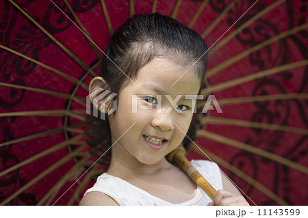 Little asian girl with traditional Asian umbrella. Little asian girl with traditional Asian umbrella. 11143599