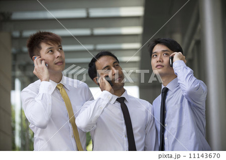 Group of Asian business colleagues using smartphone's. 11143670