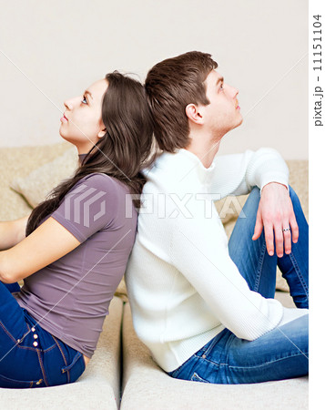 guy and girl sitting back to back 11151104