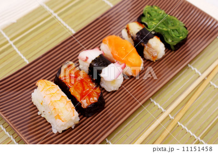 Sushi nigiri in with dish with bamboo stick pattern background Sushi nigiri in with dish with bamboo stick pattern background 11151458