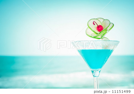 Blue margarita cocktail with lime fruit and cherry decoration Blue margarita cocktail with lime fruit and cherry decoration 11151499