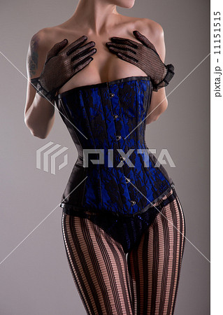 Busty woman wearing black and blue corset - Stock Photo [11151515] - PIXTA