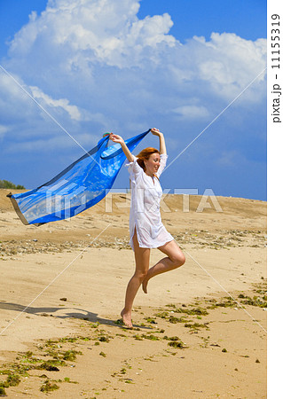 The young beautiful woman on an ocean coast. Indonesia. Bali... 11155319