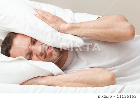 Portrait of dissatisfied Young Caucasian man in bed Portrait of dissatisfied Young Caucasian man in bed 11156165