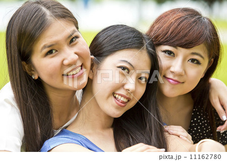 Girl friends having fun in the park 11162780