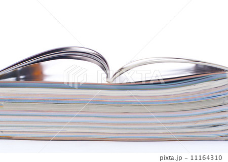 stack of colorful magazines or documents - paper edges background stack of colorful magazines or documents - paper edges background 11164310