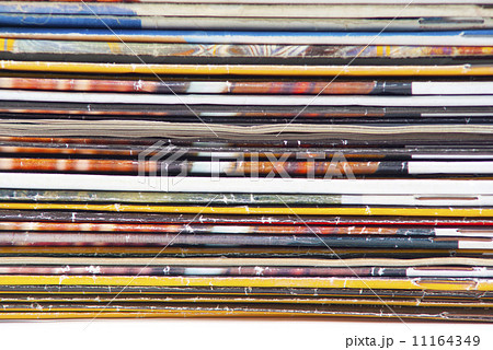 stack of colorful magazines or documents - paper edges background stack of colorful magazines or documents - paper edges background 11164349