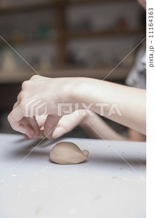 Girl make toyfrom clay 11164363