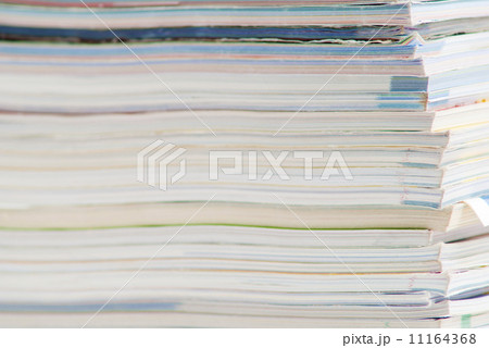 stack of colorful magazines or documents - paper edges background stack of colorful magazines or documents - paper edges background 11164368