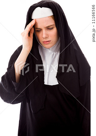 Young nun suffering from headache Young nun suffering from headache 11166566