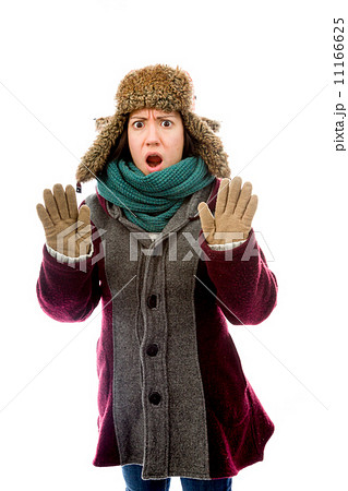 Young woman in warm clothing and making stop gesture sign Young woman in warm clothing and making stop gesture sign 11166625