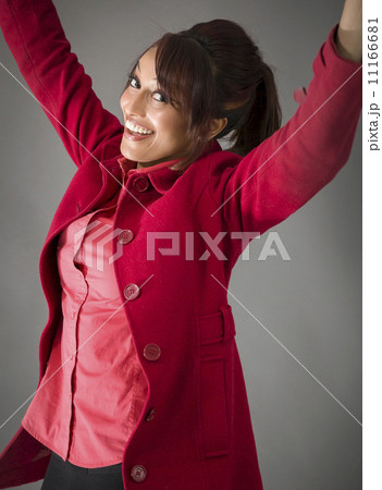 Indian young woman celebrating success Indian young woman celebrating success 11166681