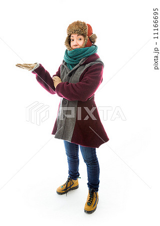 Young woman in warm clothing and showing something Young woman in warm clothing and showing something 11166695