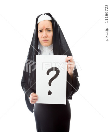 Young nun showing question mark on white background Young nun showing question mark on white background 11166722