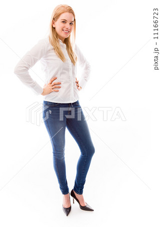 Young woman smiling with her arms akimbo Young woman smiling with her arms akimbo 11166723