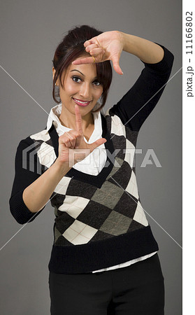 Indian businesswoman looking through finger frame 11166802