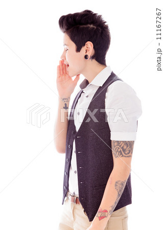 Side profile of a young woman whispering 11167267