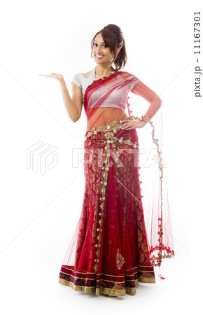 Young Indian woman showing product with open hand palm Young Indian woman showing product with open hand palm 11167301