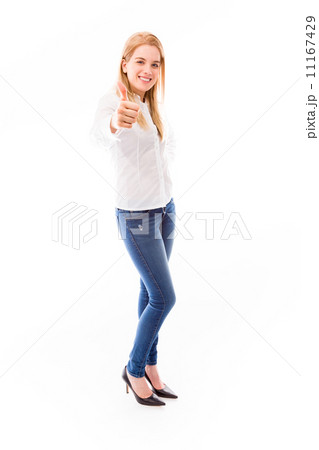 Young woman standing and showing thumbs up sign Young woman standing and showing thumbs up sign 11167429