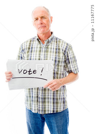 Senior man holding a message board with the text words "Vote" Senior man holding a message board with the text words "Vote" 11167775