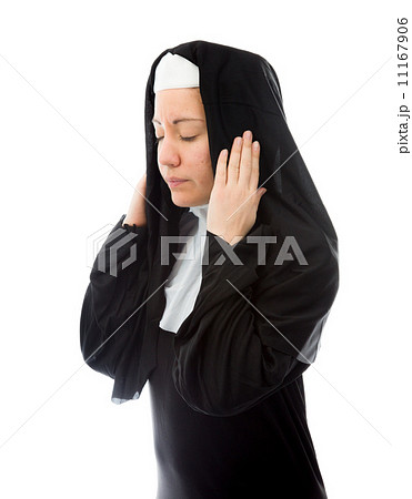 Young nun covering ears with hands Young nun covering ears with hands 11167906