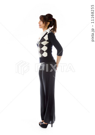 Side profile of an Indian young woman looking at distance with hands behind back 11168255