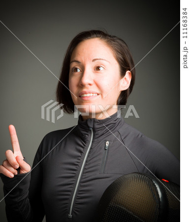 Female fencer pointing her finger up Female fencer pointing her finger up 11168384
